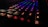 A close-up of a sleek mechanical keyboard with colorful backlighting.