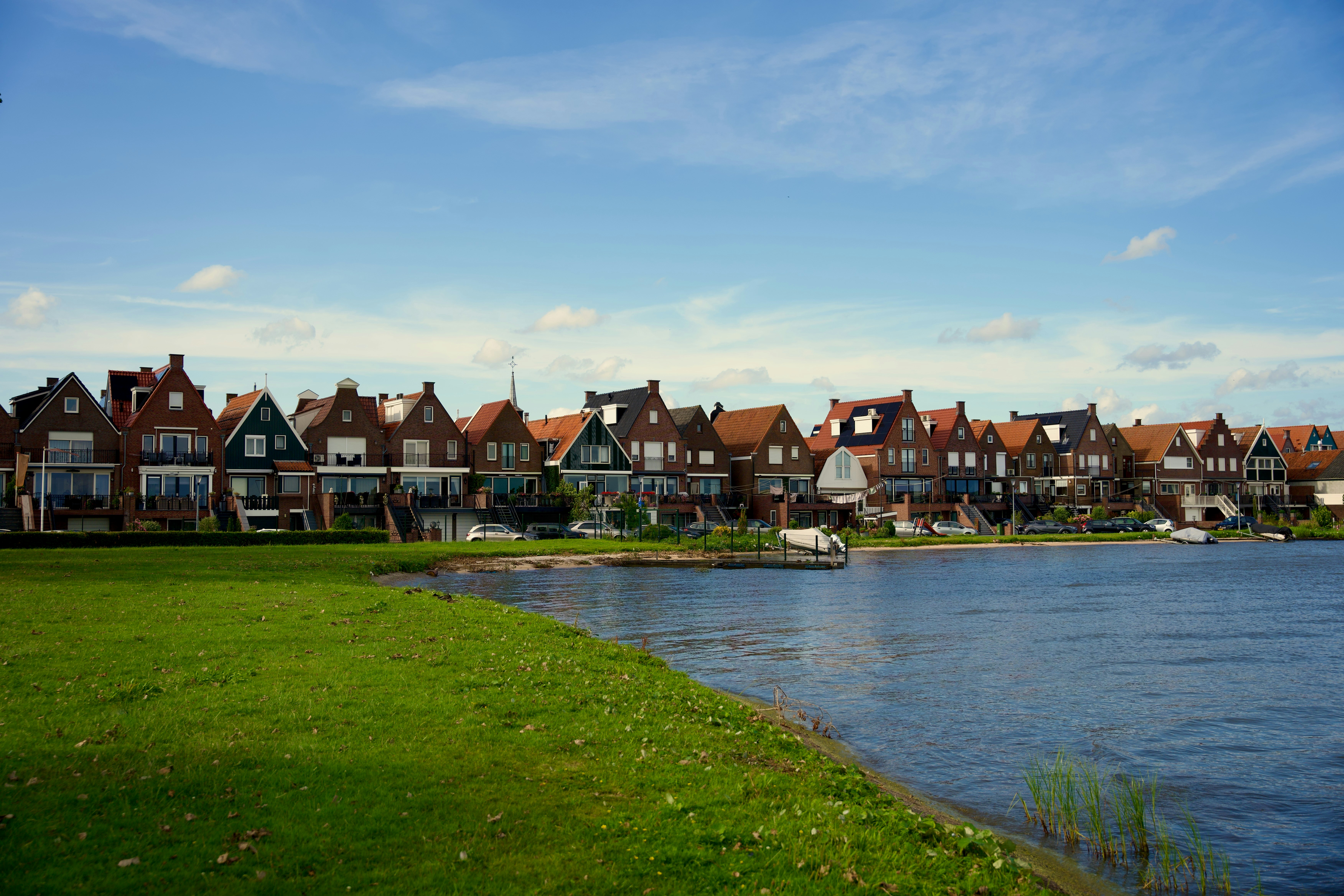 a row of houses next to a body of water