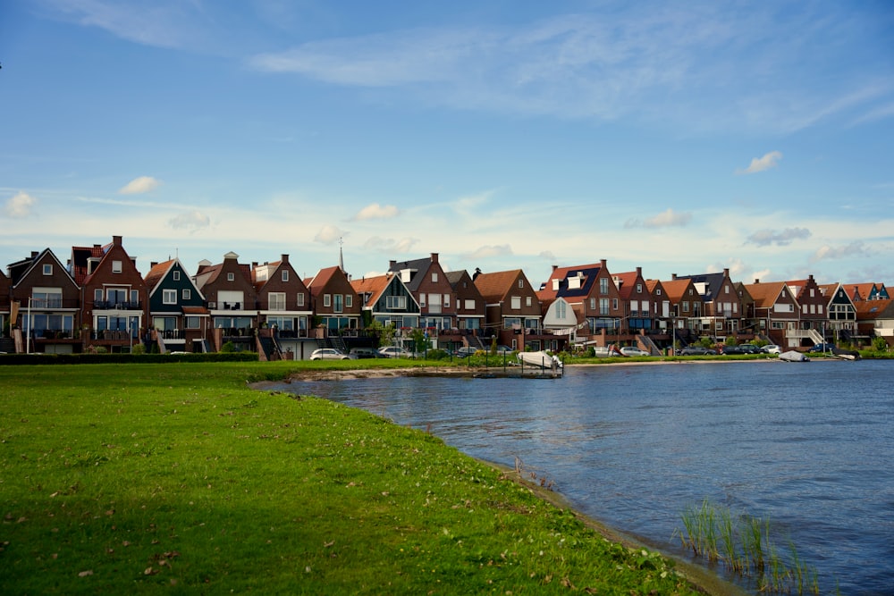 a row of houses next to a body of water