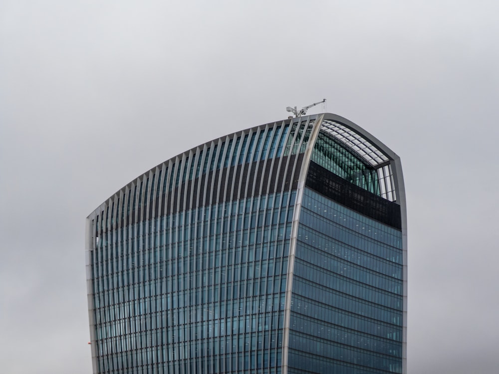 a tall building with a cross on top of it