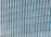 Close-up of a custom steel window installed on a modern container building.