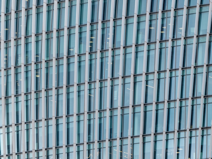 Close-up of a sleek armored glass window installed in a modern office building.