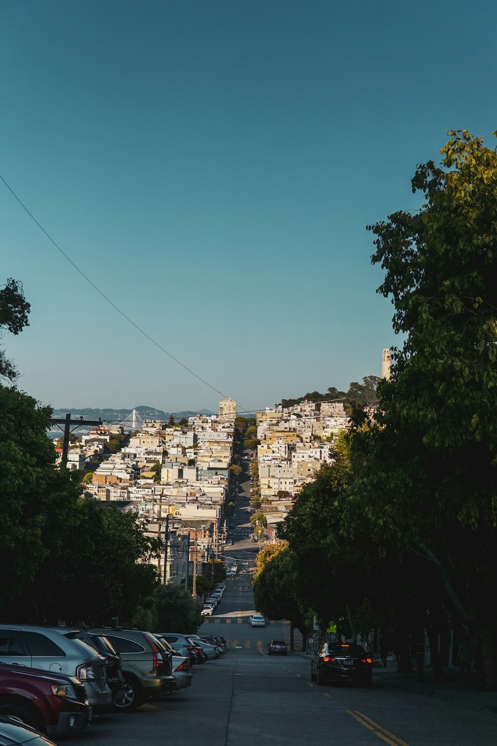 a street with cars parked on both sides of it