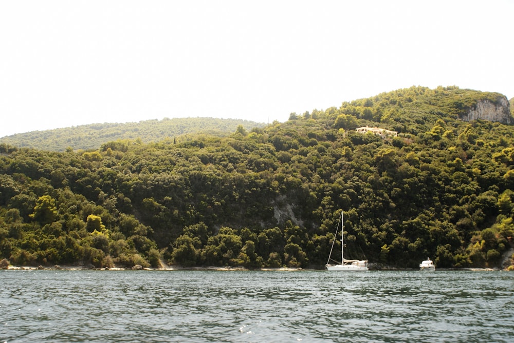 a boat is in the middle of a body of water