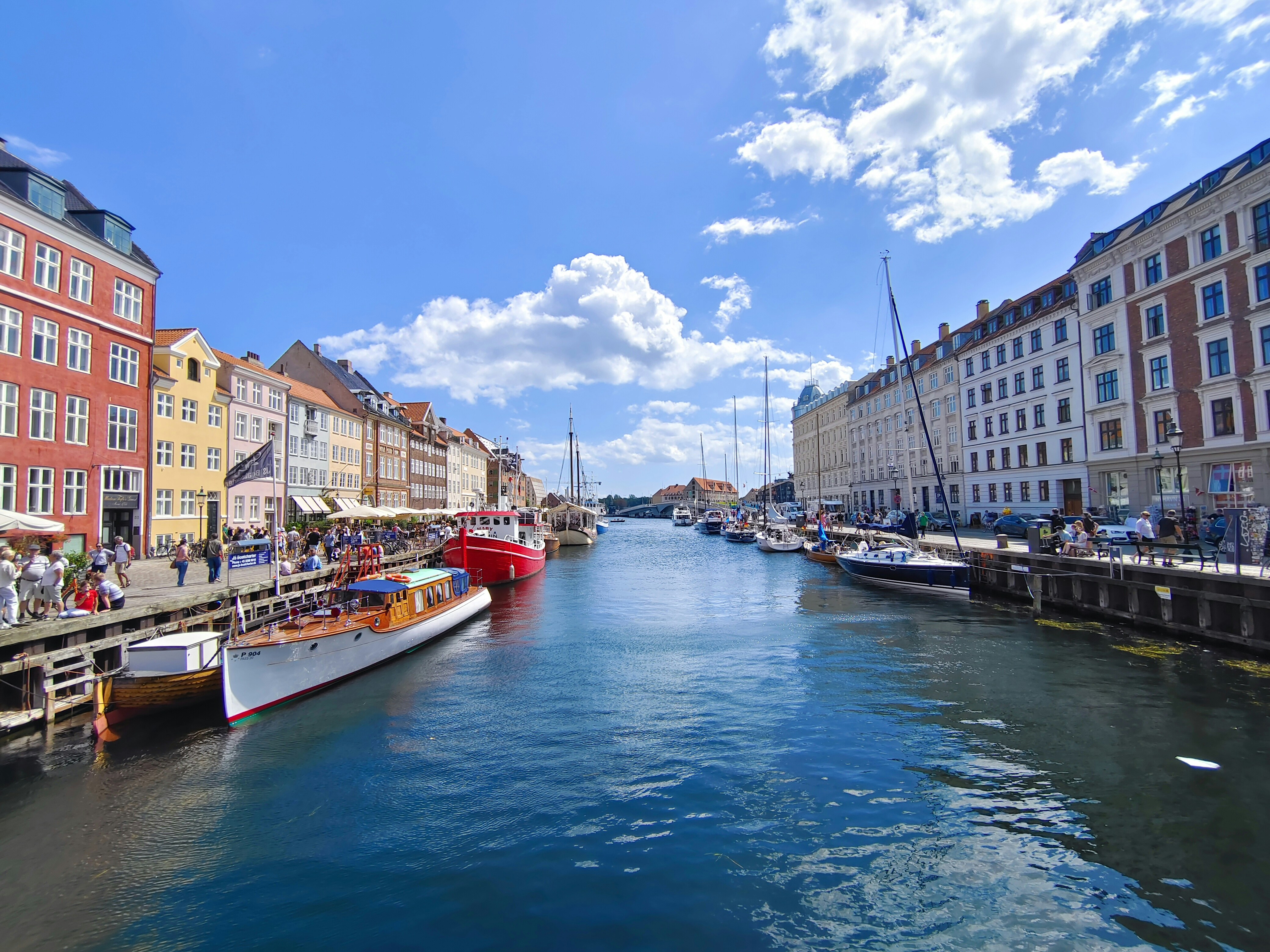 a waterway with boats and buildings on both sides