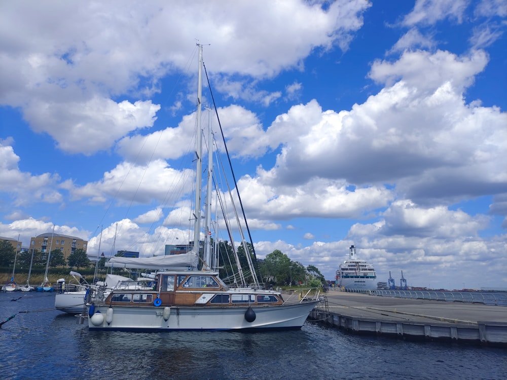 a sailboat is docked at a pier