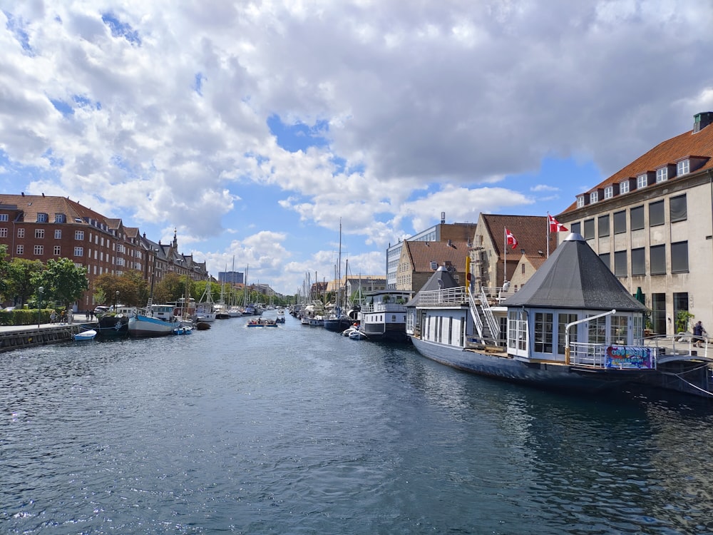 a waterway with boats and buildings on both sides