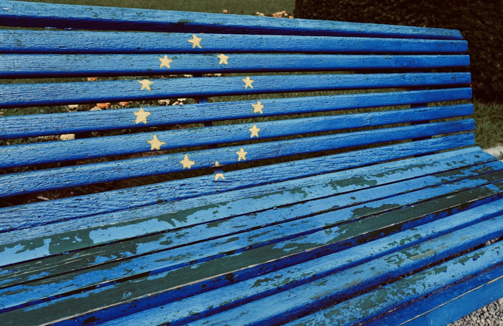 a blue bench with stars painted on it