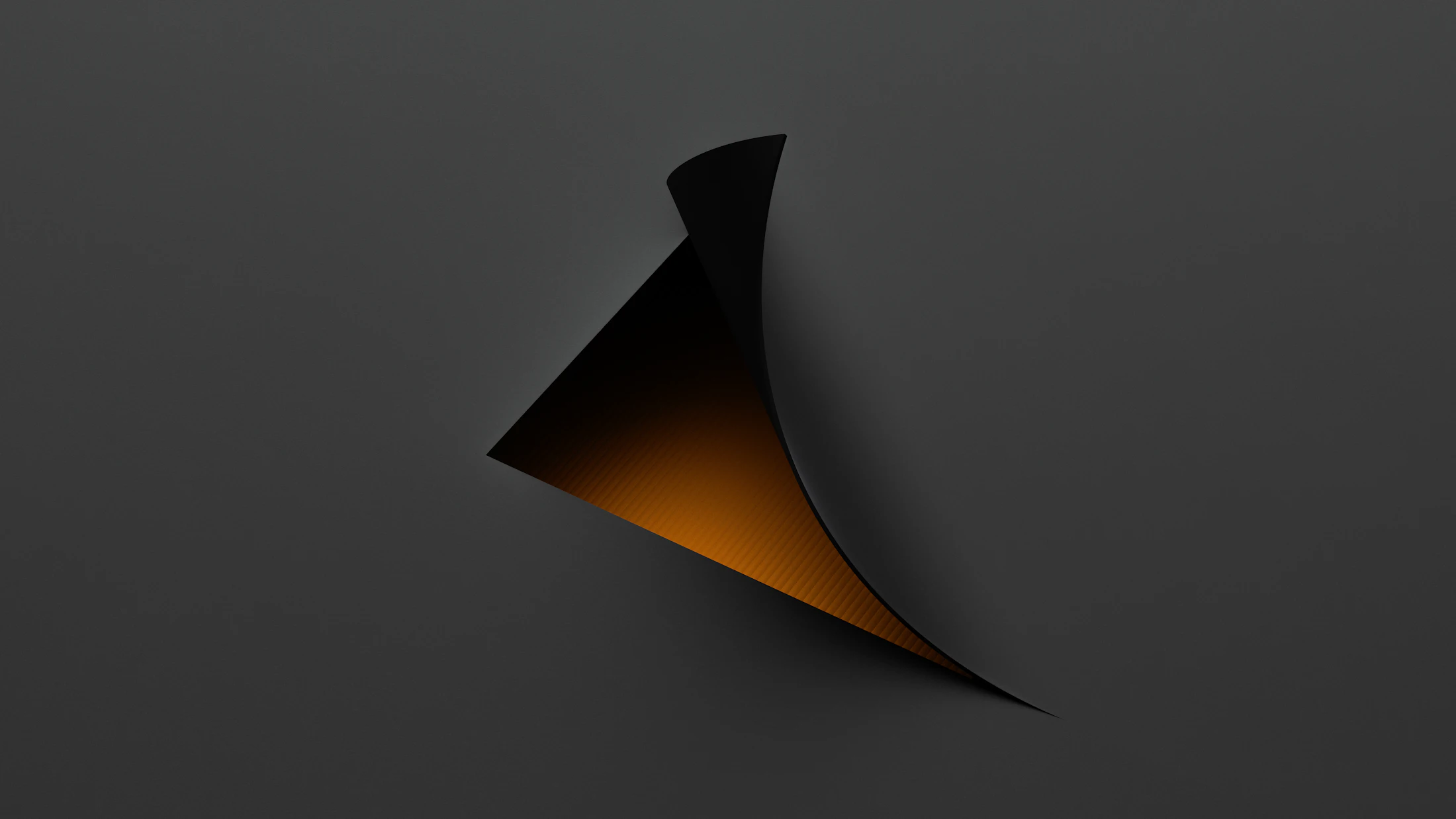 A black and orange 3D form with a smooth curved edge