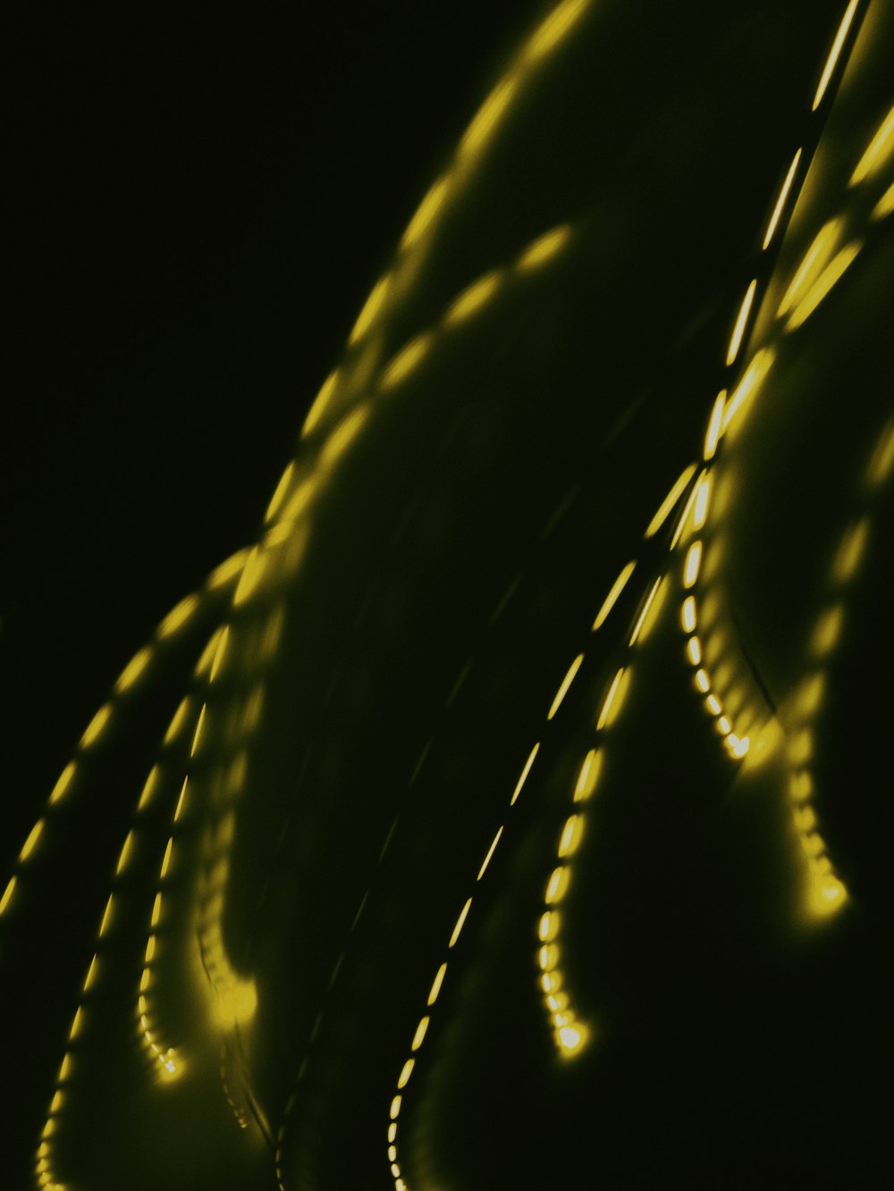 a close up of a car's lights in the dark