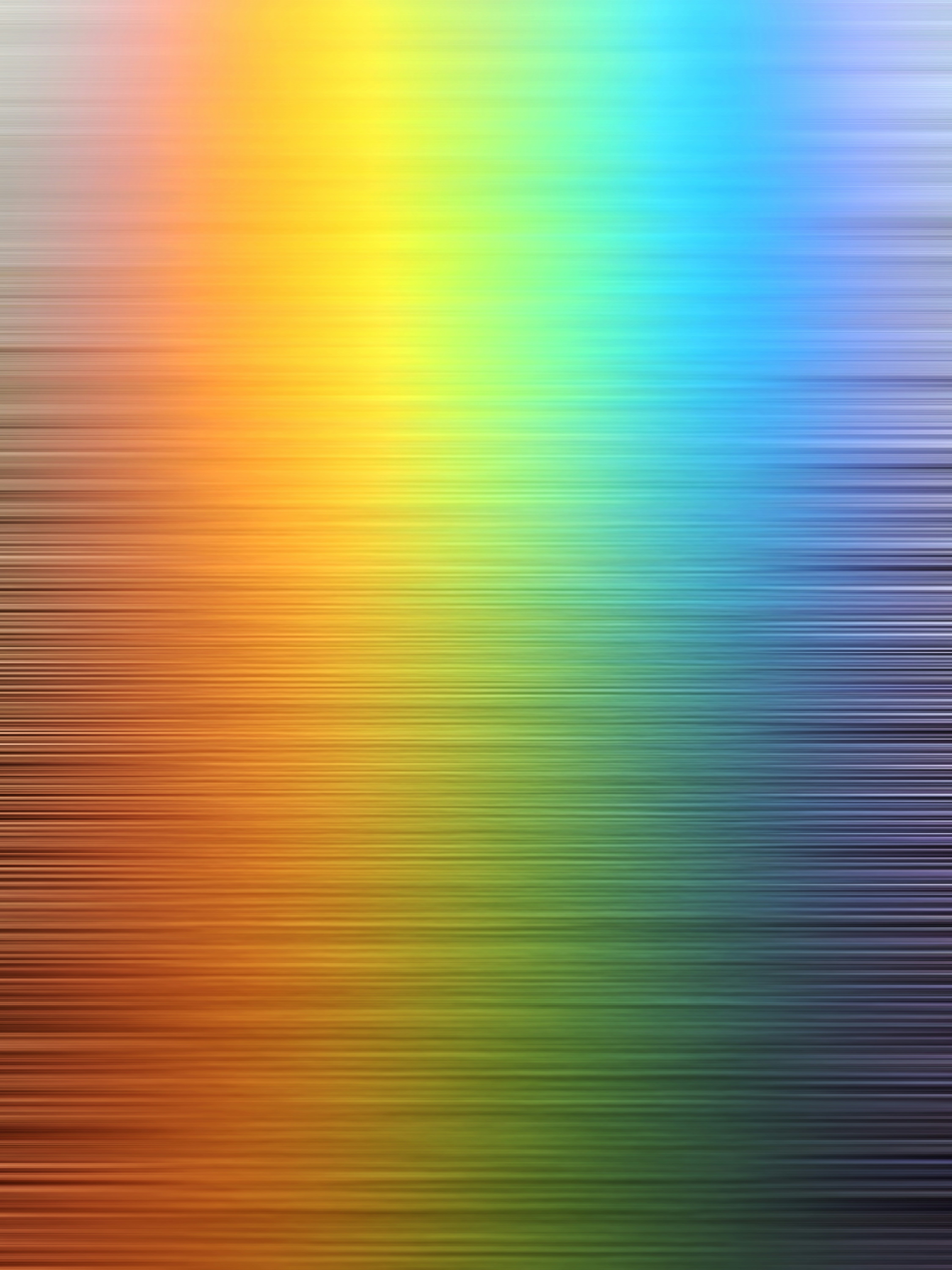 a blurry image of a rainbow colored background