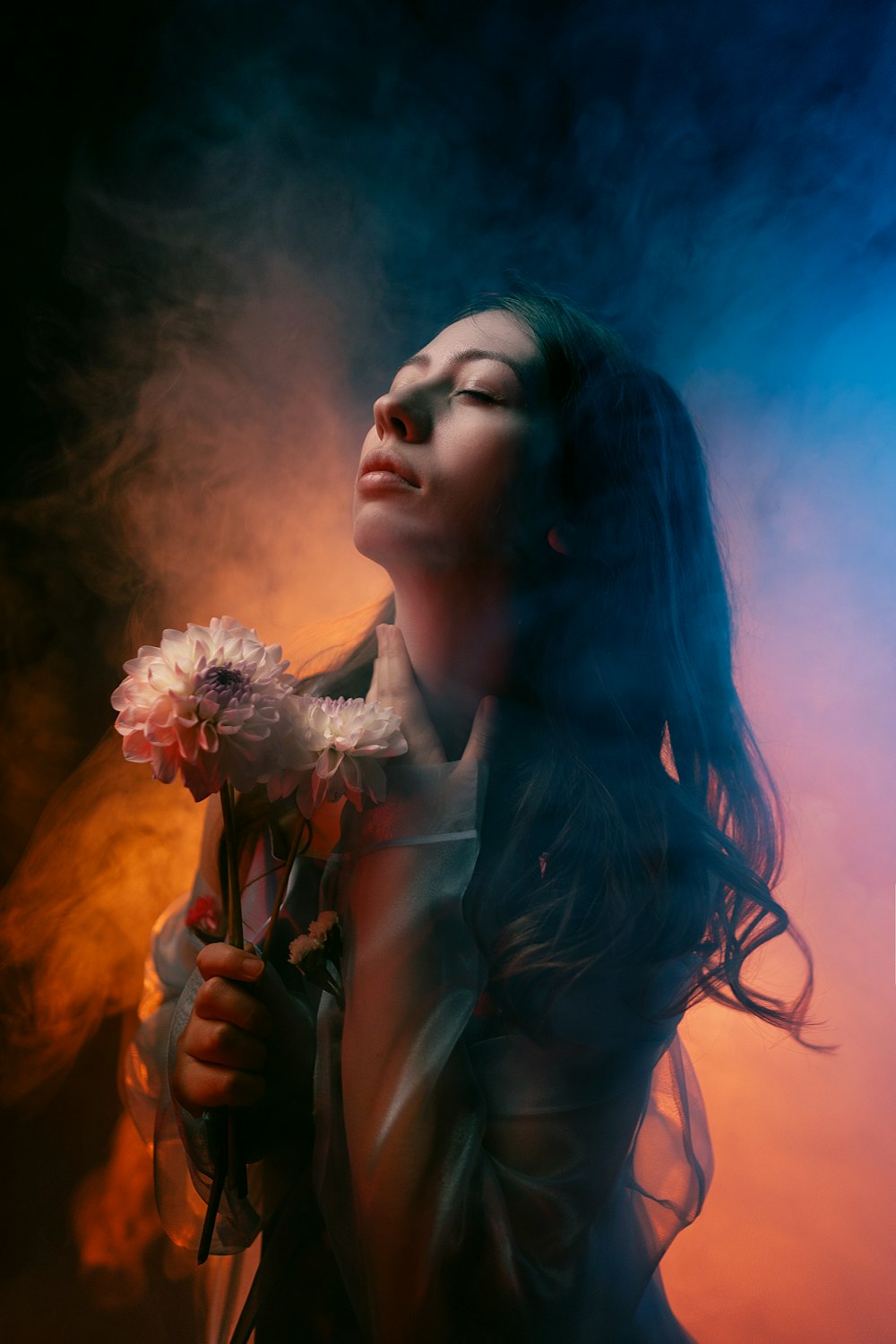 a woman holding a bouquet of flowers in her hand