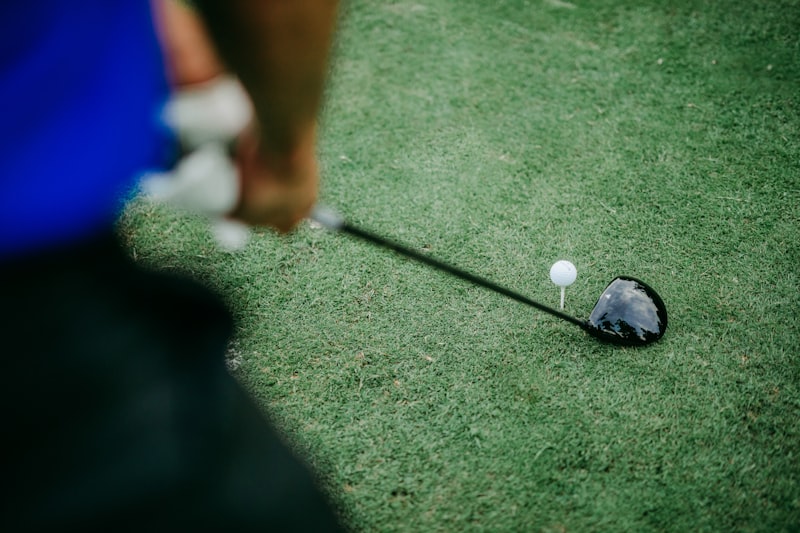 a golf ball on the ground with a driver