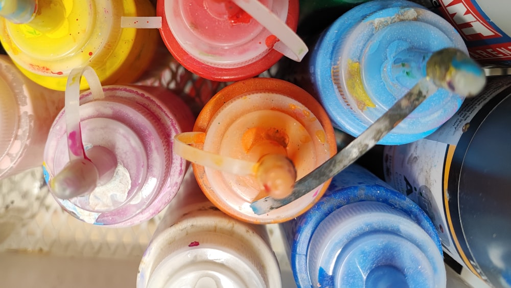 a close up of many different colored paints