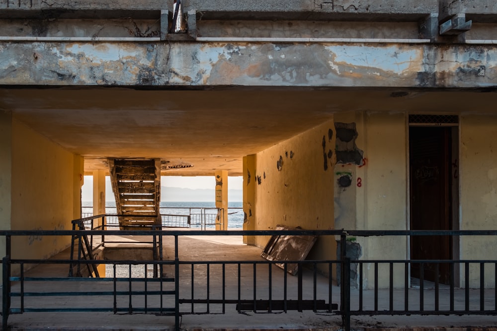 a stairway leading to a balcony with a view of the ocean