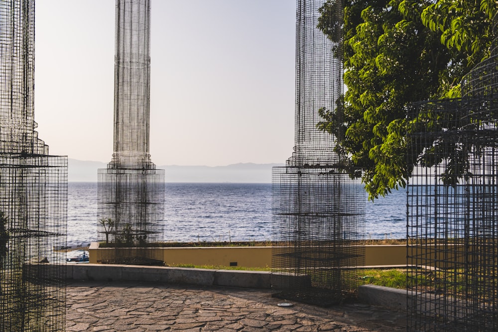 a couple of tall buildings sitting next to a body of water