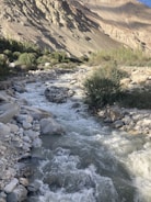 A clean water source flowing through a dry landscape.