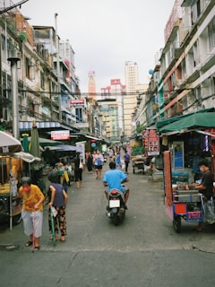 A lively street scene from Saigon with bustling markets and vibrant food stalls.