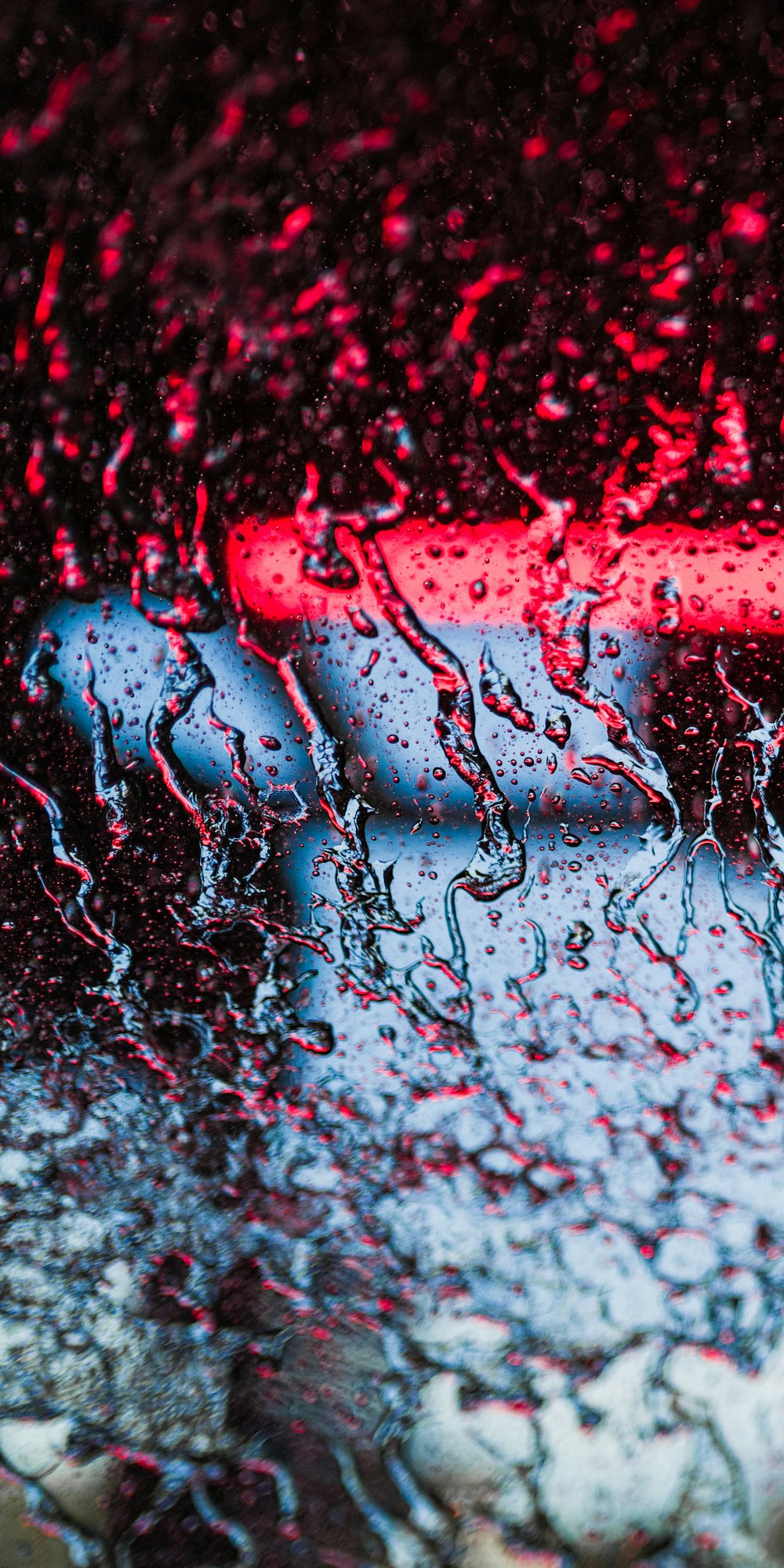 a close up of a rain covered window