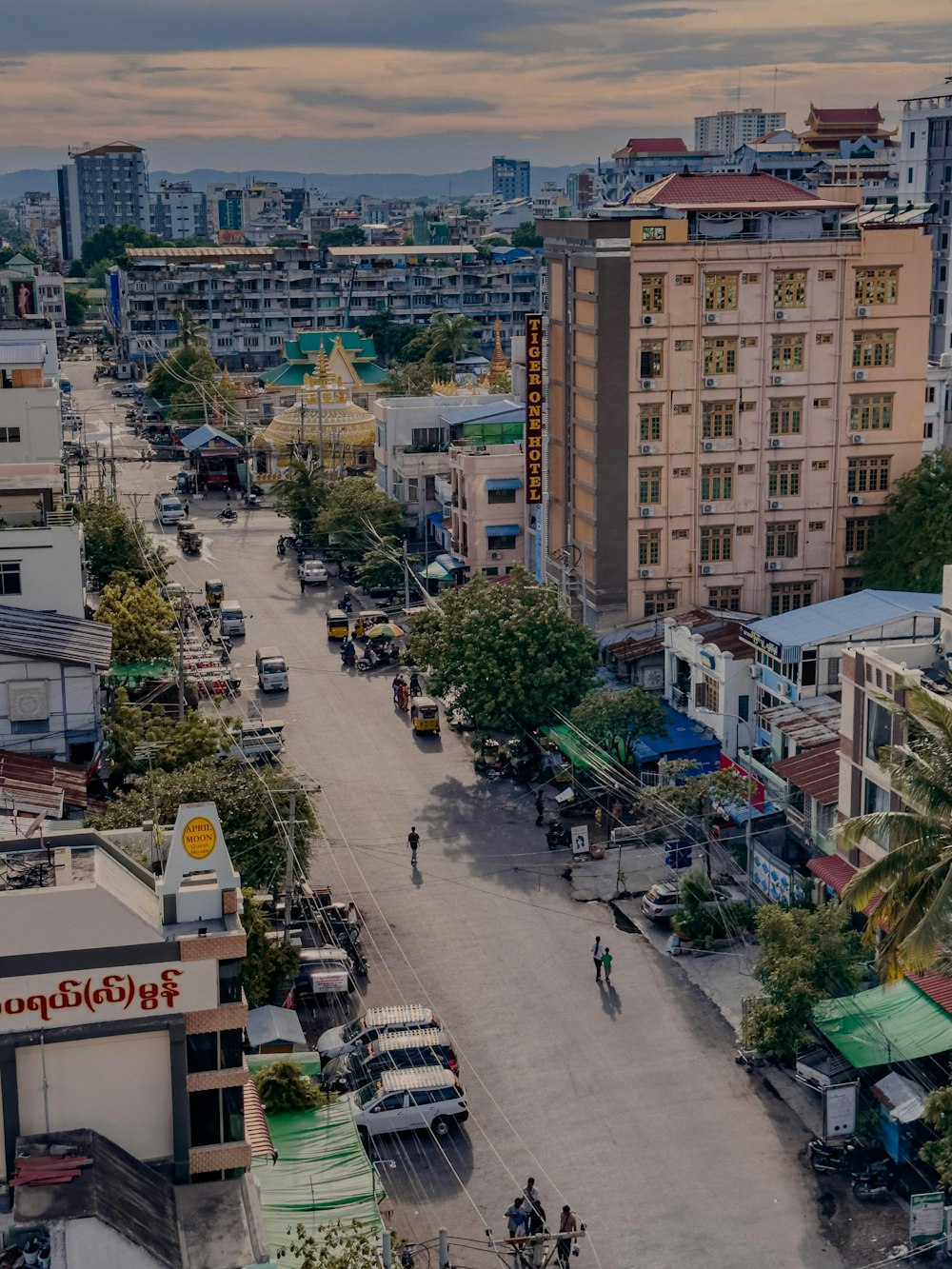 a city street filled with lots of traffic and tall buildings