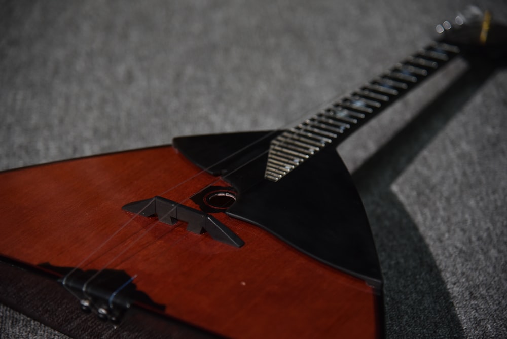 a close up of a wooden instrument on a table