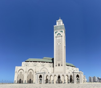 a large white building with a clock tower CASABLANCA