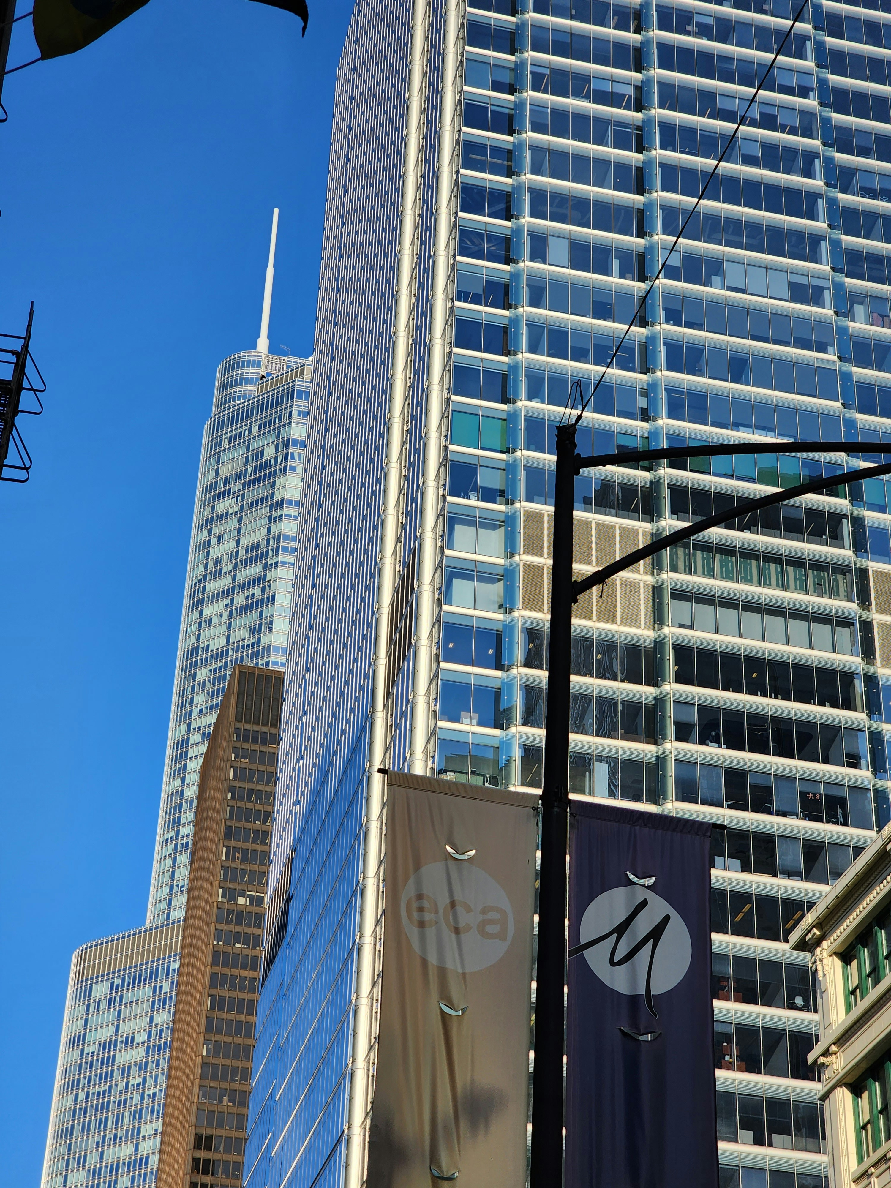 a city street with tall buildings in the background