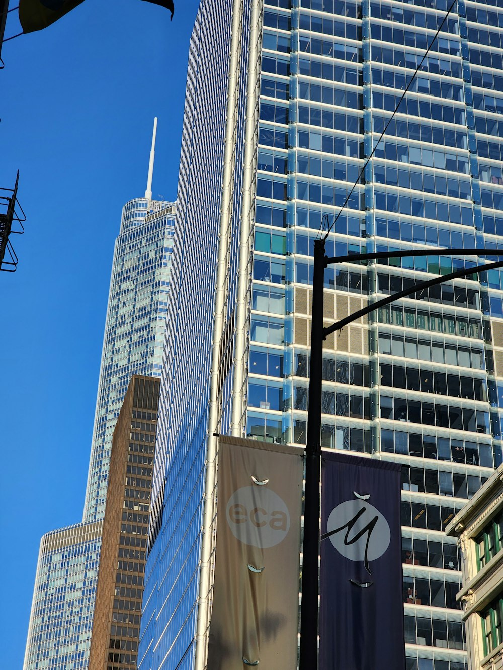 a city street with tall buildings in the background