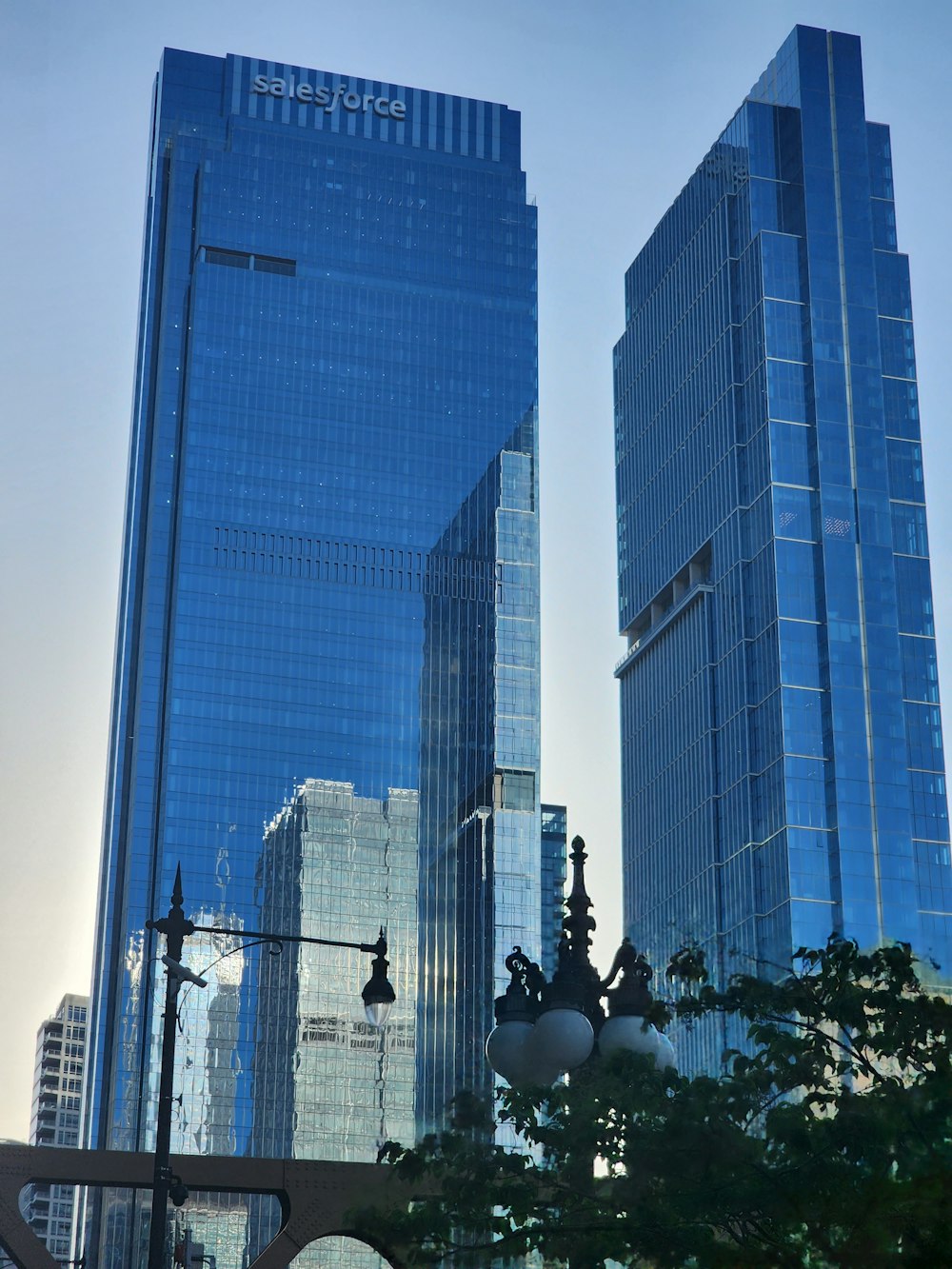 a couple of tall buildings sitting next to each other