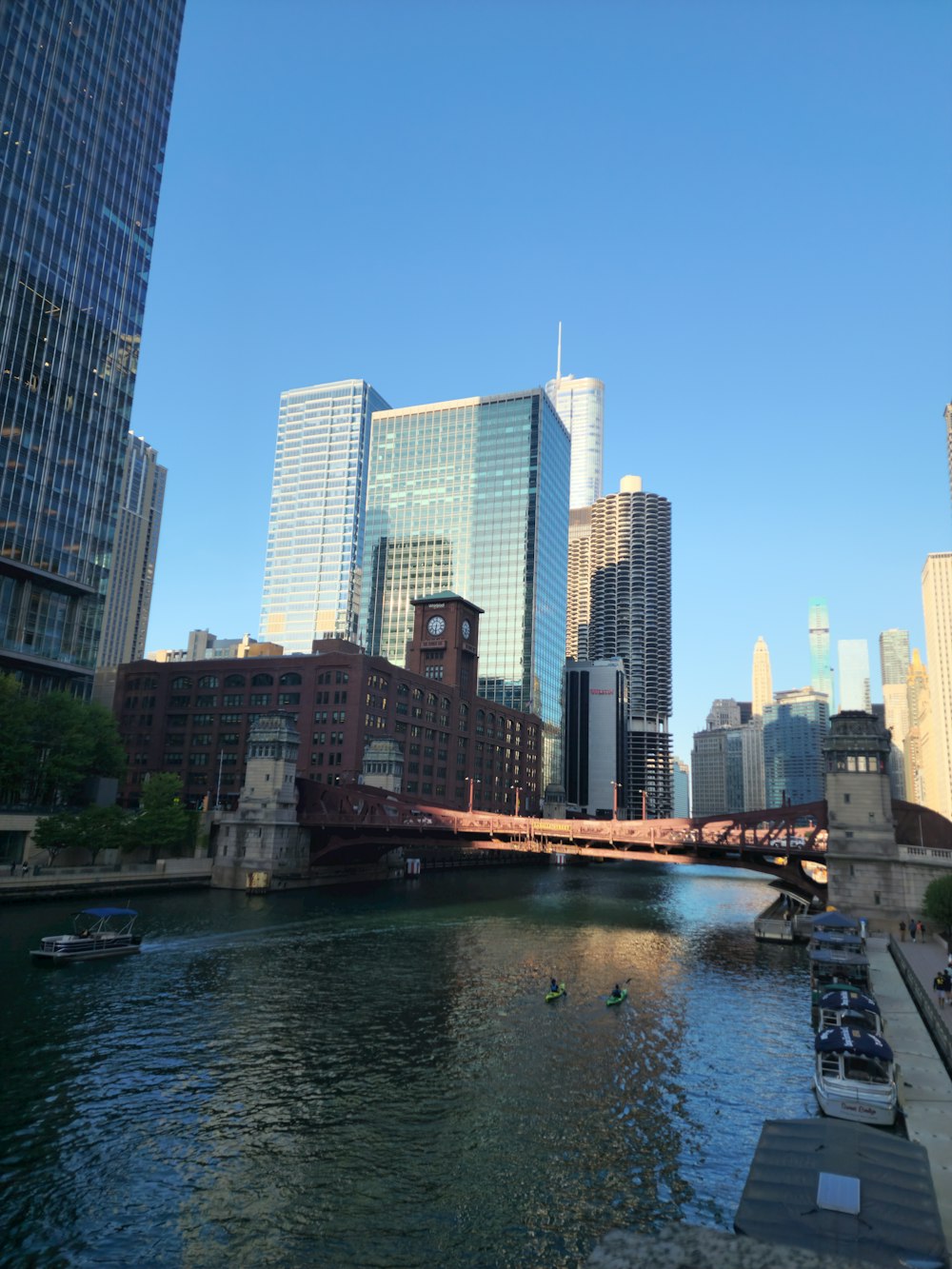 a river running through a city next to tall buildings