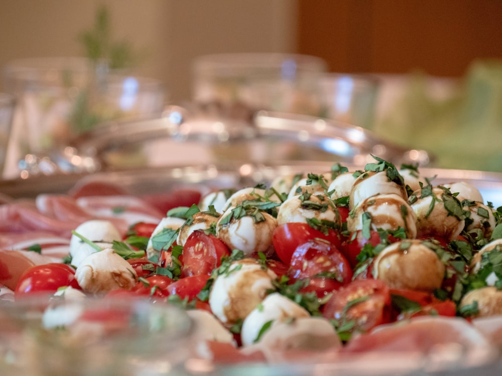 a plate of food that includes tomatoes and mozzarella