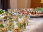 a table full of food and glasses of water