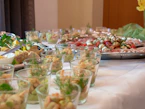 a table full of food and glasses of water