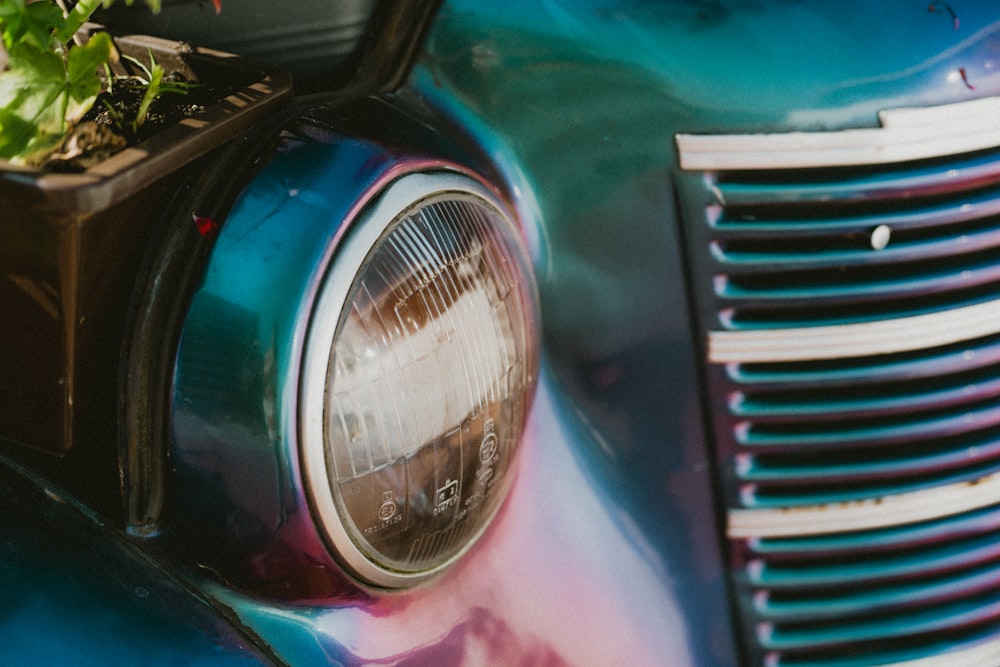 a close up of a car with a planter on the front