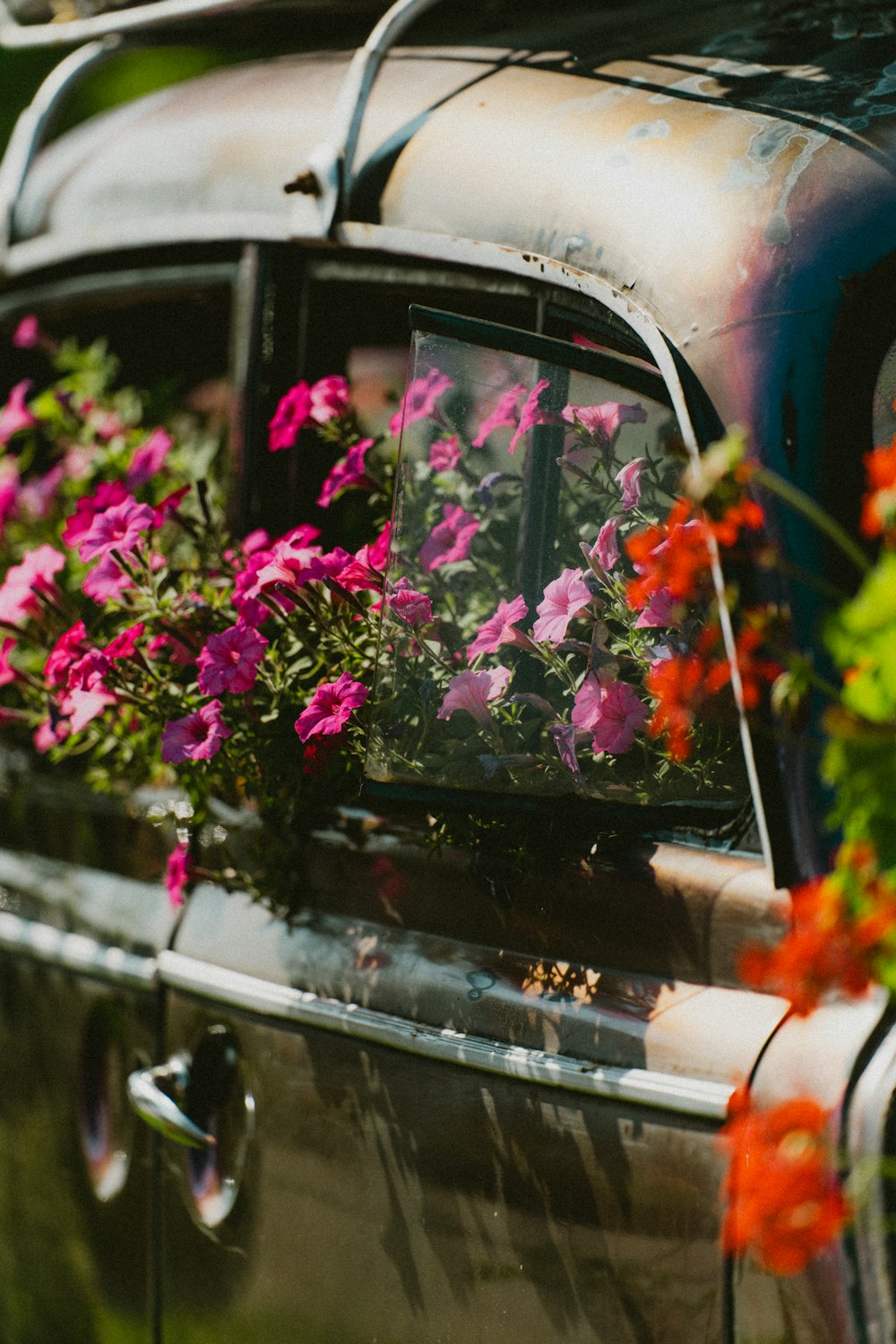 a car with a bunch of flowers in the window