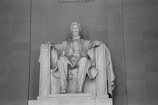a black and white photo of a statue of abraham lincoln