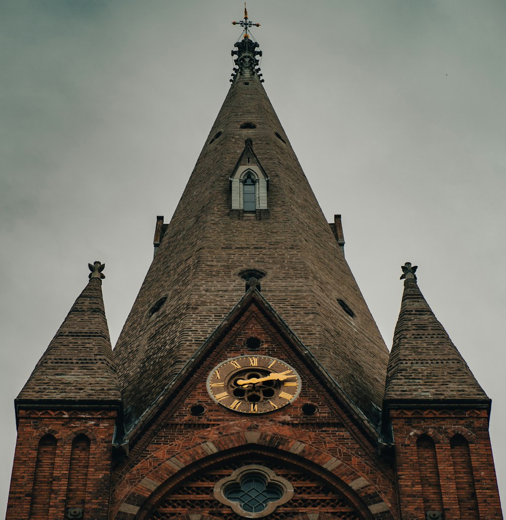 a clock on the side of a church tower