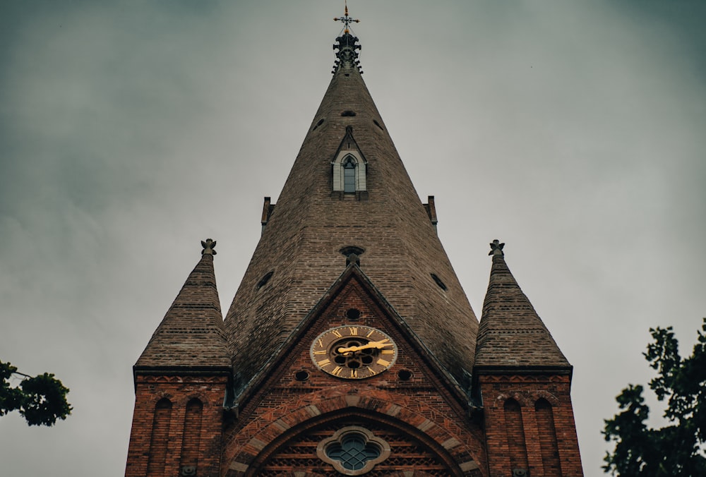 a church steeple with a clock on it