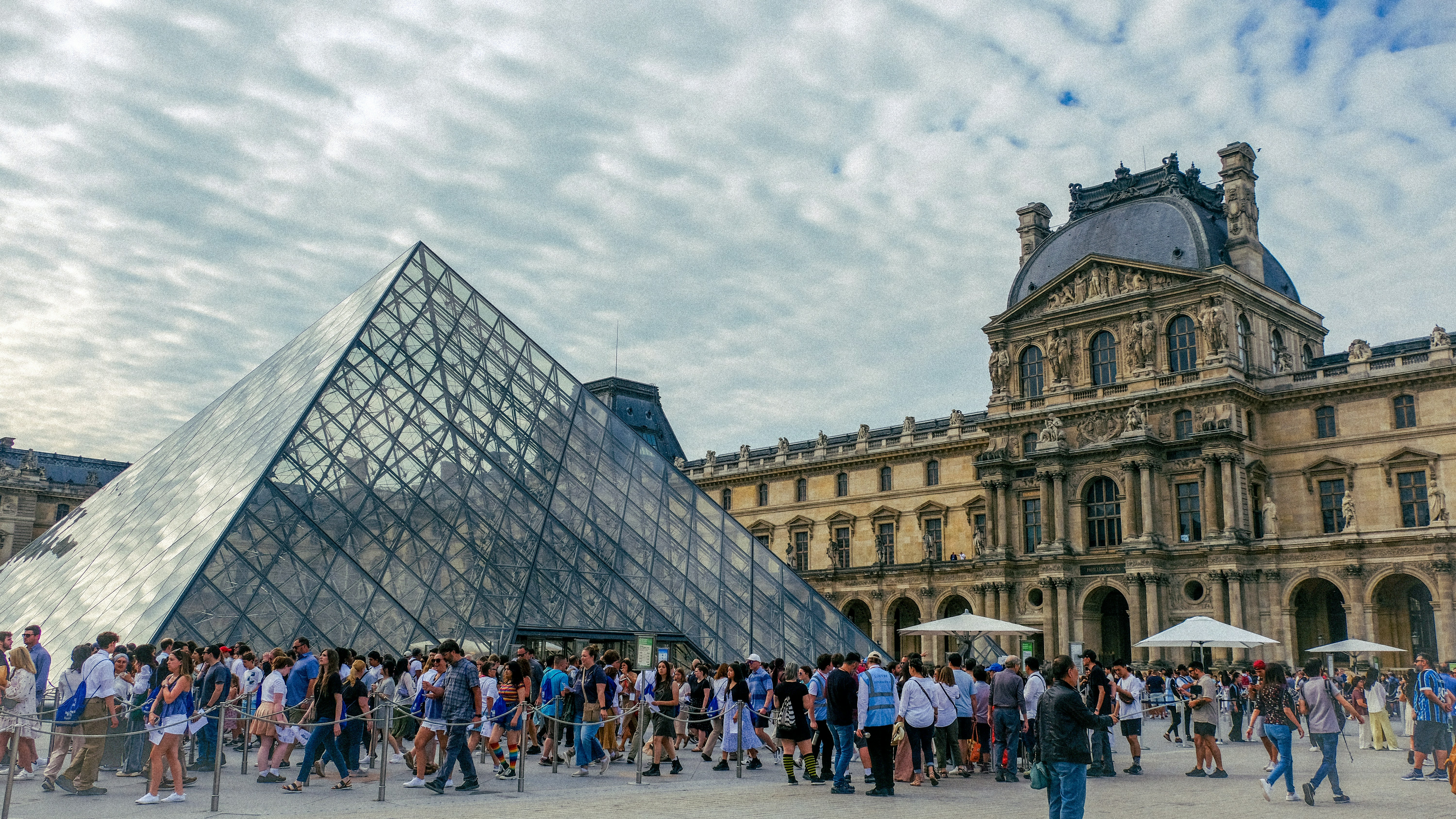 a large group of people standing in front of a building