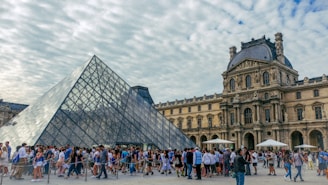 a large group of people standing in front of a building