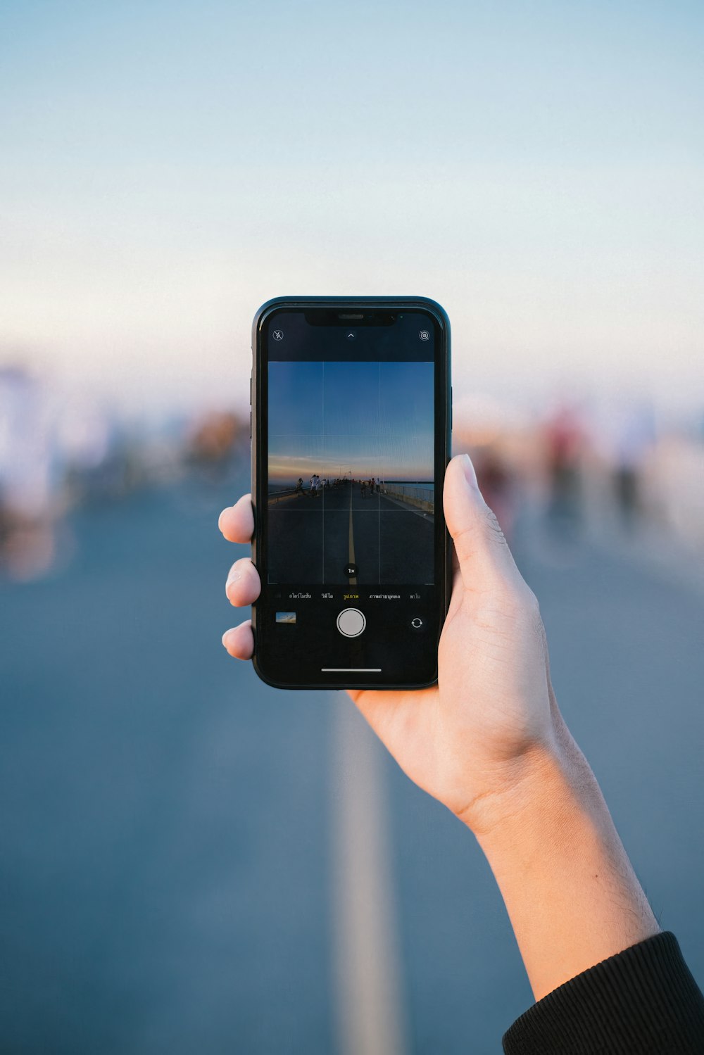 a person taking a picture with a cell phone