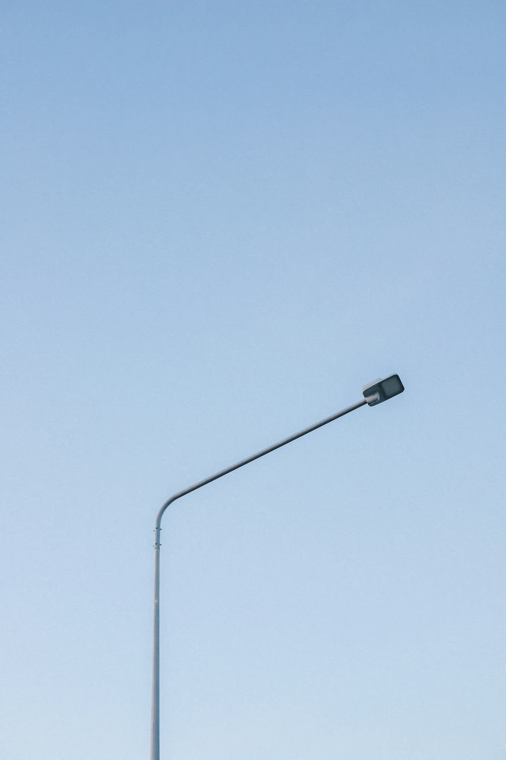 a street light with a clear sky in the background