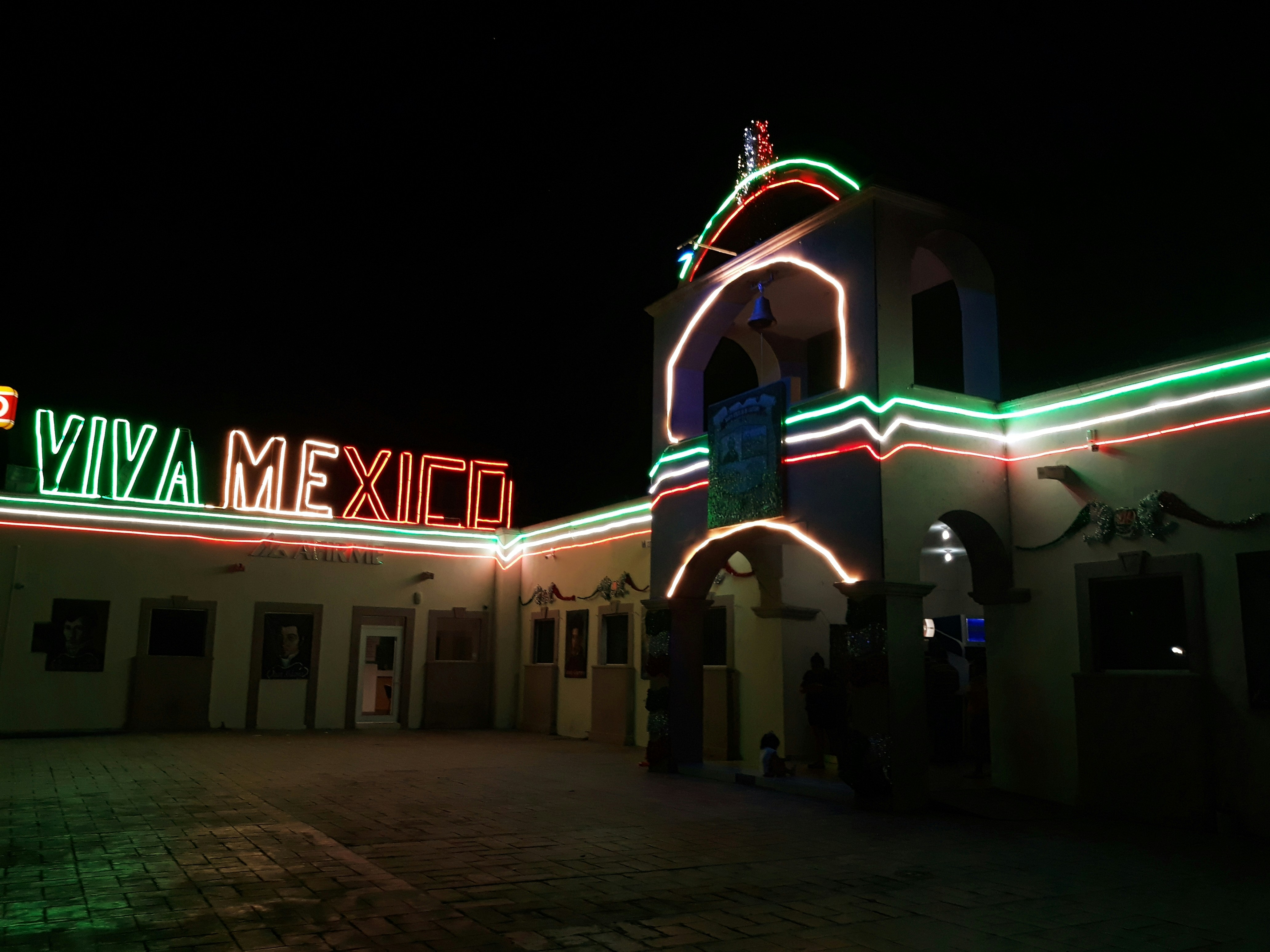 a building that has a lot of lights on it, 