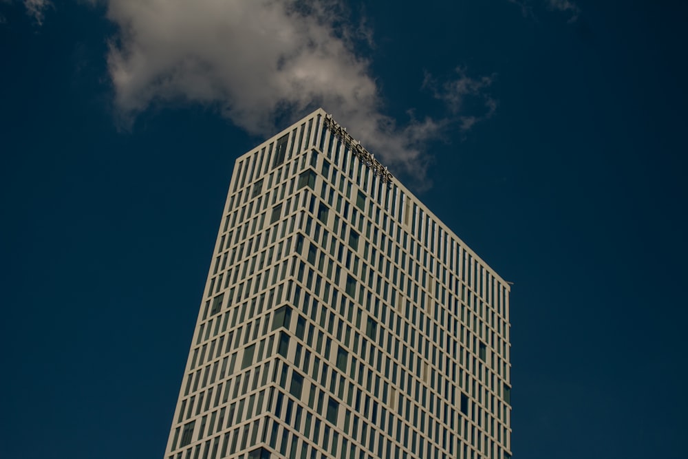 a very tall building with a sky background