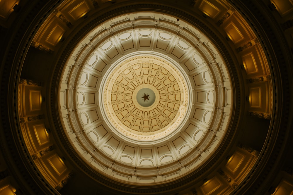 the ceiling of a building with a circular light