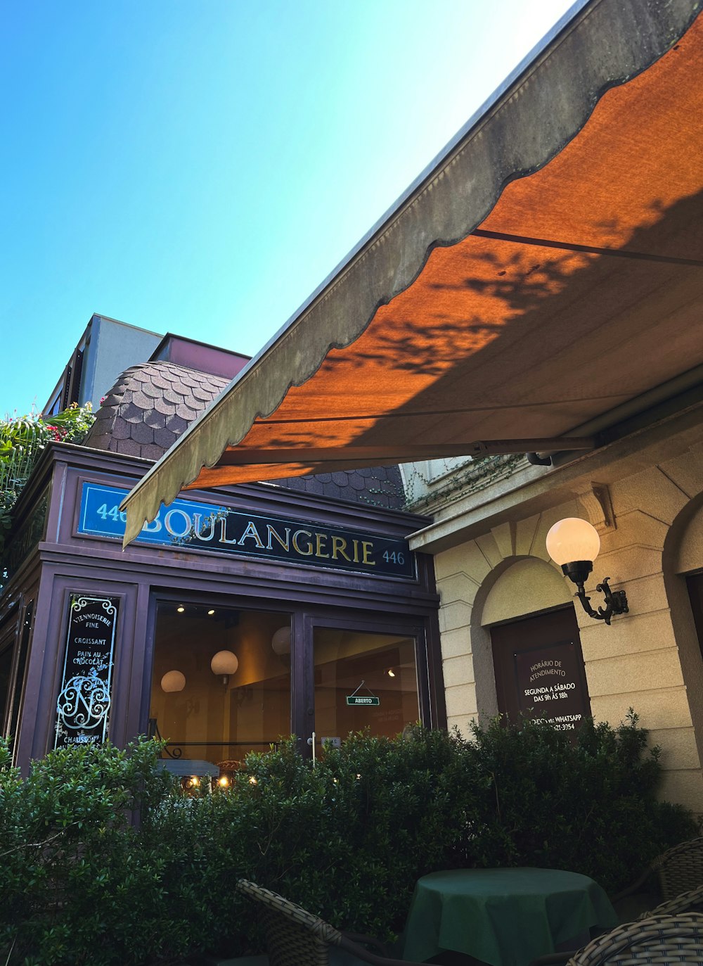 the outside of a restaurant with an awning