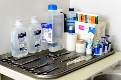 a sink with a bunch of items on top of it