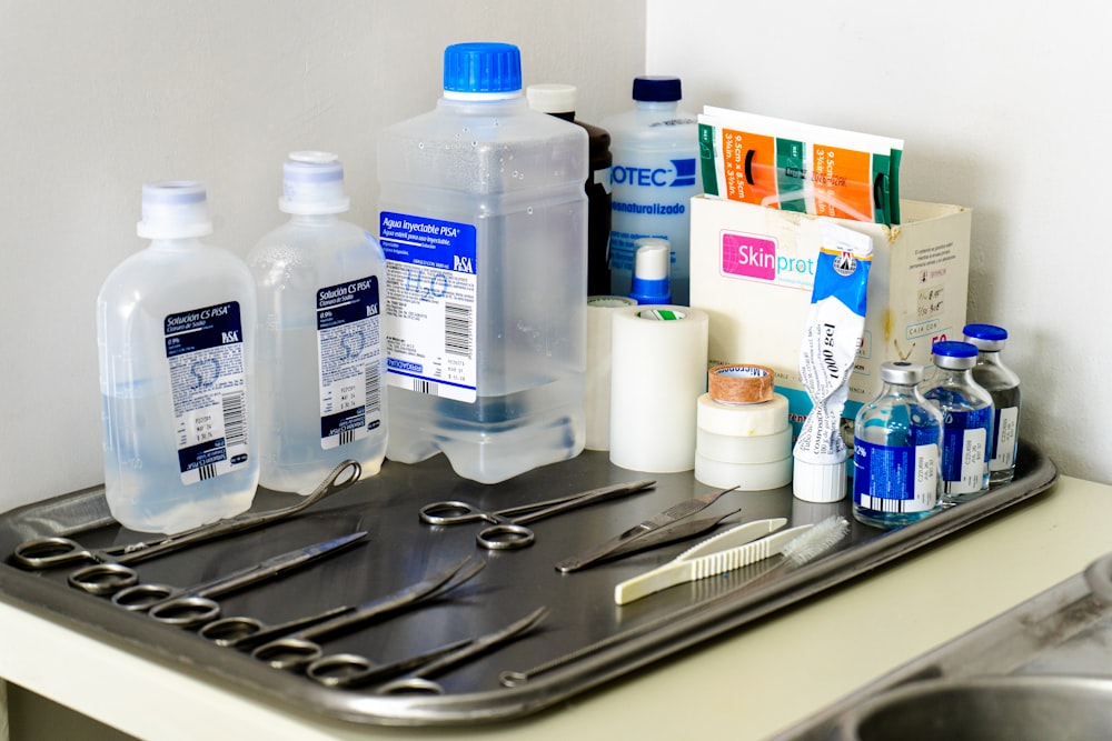 a sink with a bunch of items on top of it