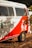 A vintage van painted in white and red with cactus and sun designs on the side. The text 'Instituto Céu No Sertão' is visible, along with Instagram handle details and a message in Portuguese. The van is located outdoors with foliage partially shading it.