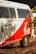 A vintage van painted in white and red with cactus and sun designs on the side. The text 'Instituto Céu No Sertão' is visible, along with Instagram handle details and a message in Portuguese. The van is located outdoors with foliage partially shading it.